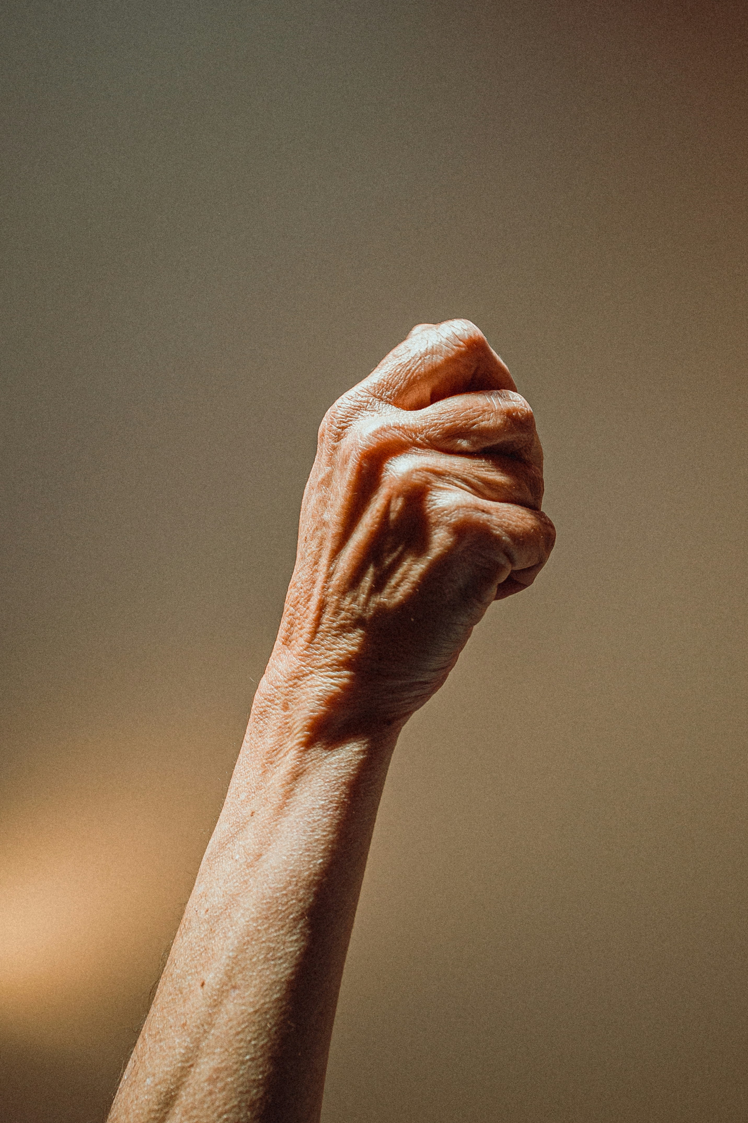 The raised fist an elderly woman